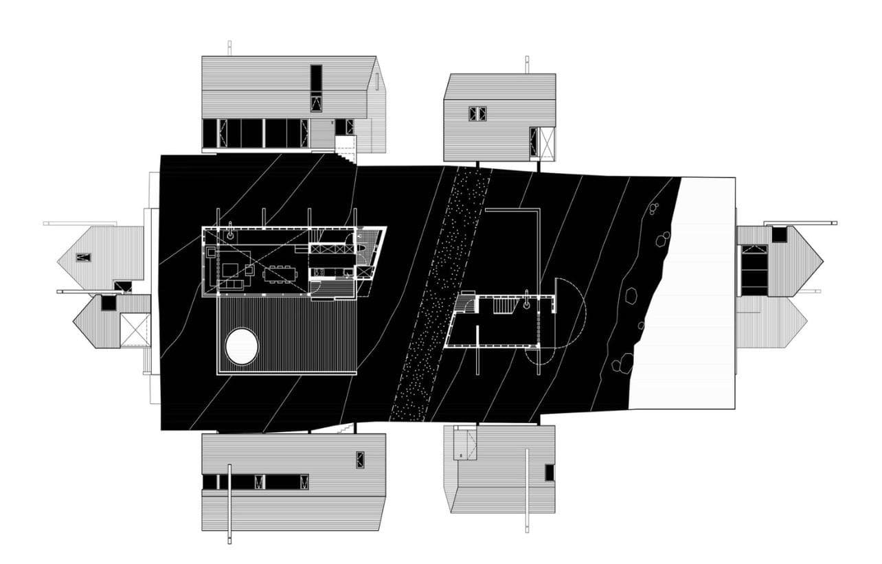 Architectural roof plan — clustered cabins arranged around a dark central mass
