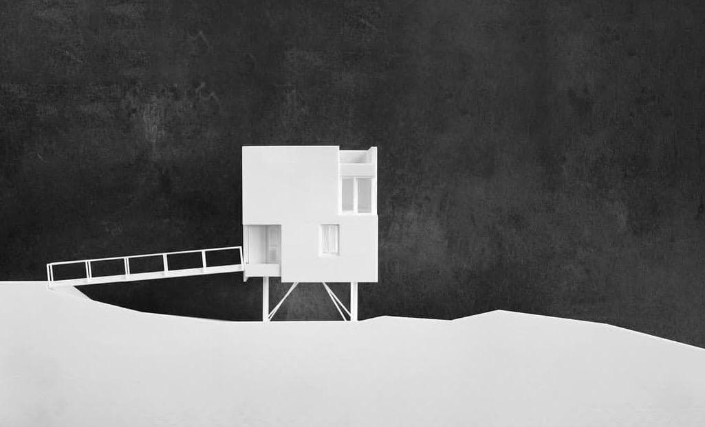 Study model — a white house model perched on a sculpted hillside